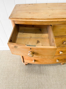 A 19th Century Bow Front English Chest of Drawers