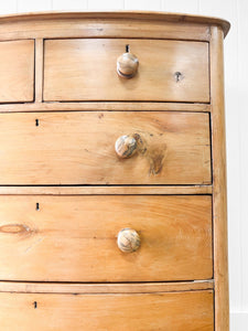 A 19th Century Bow Front English Chest of Drawers