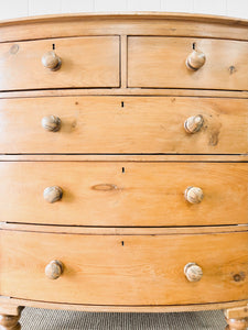 A 19th Century Bow Front English Chest of Drawers