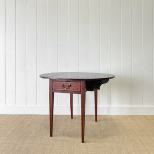 A George III Mahogany and Satinwood Crossbanded Pembroke Table