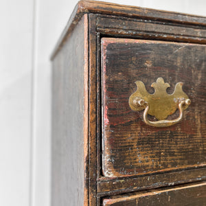 A Narrow Rustic Chest of Drawers with Chippendale Hardware Night Stand