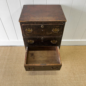 A Narrow Rustic Chest of Drawers with Chippendale Hardware Night Stand