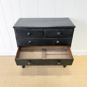 An Ebonized Antique English Chest of Drawers/Dresser