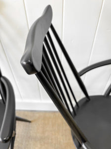 A Set of 4 Black Ercol Chairs