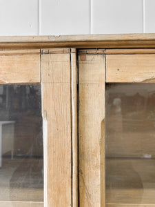 A 19th Century English Pine Glazed Bookcase on Bun Feet