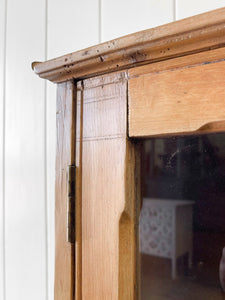 A 19th Century English Pine Glazed Bookcase on Bun Feet