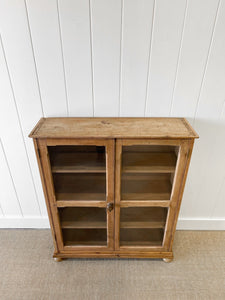 A 19th Century English Pine Glazed Bookcase on Bun Feet