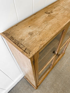 A 19th Century English Pine Glazed Bookcase on Bun Feet