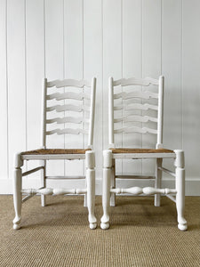 A Pair of Ladderback Rush Seat Chairs Painted White