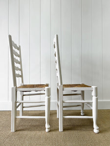 A Pair of Ladderback Rush Seat Chairs Painted White