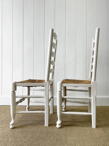 A Pair of Ladderback Rush Seat Chairs Painted White