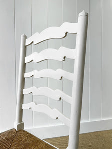 A Pair of Ladderback Rush Seat Chairs Painted White