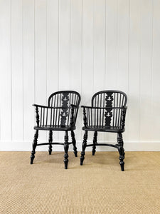 A Set of Four Black Windsor Armchairs