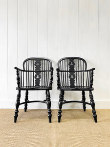 A Set of Four Black Windsor Armchairs