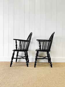 A Set of Four Black Windsor Armchairs