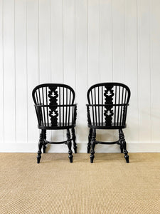 A Set of Four Black Windsor Armchairs