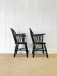 A Set of Four Black Windsor Armchairs