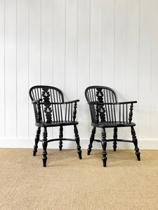 A Set of Four Black Windsor Armchairs