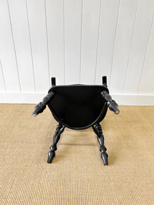 A Set of Four Black Windsor Armchairs