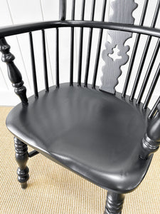 A Set of Four Black Windsor Armchairs