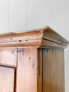 A Handsome English 19th Pine Cupboard with Dark Wooden Knobs