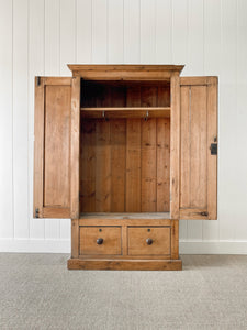 A Handsome English 19th Pine Cupboard with Dark Wooden Knobs