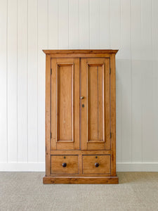 A Handsome English 19th Pine Cupboard with Dark Wooden Knobs