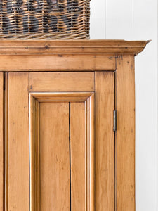 A Handsome English 19th Pine Cupboard with Dark Wooden Knobs