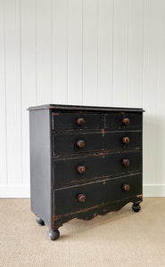 An Ebonized Antique English Chest of Drawers/Dresser