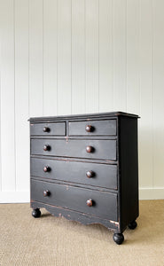 An Ebonized Antique English Chest of Drawers/Dresser