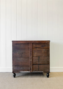 An Ebonized Antique English Chest of Drawers/Dresser