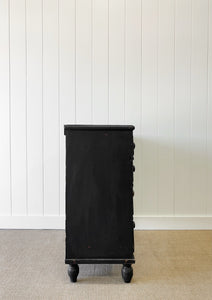 An Ebonized Antique English Chest of Drawers/Dresser