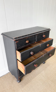 An Ebonized Antique English Chest of Drawers/Dresser