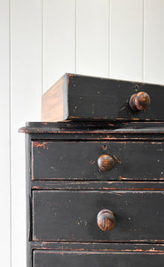 An Ebonized Antique English Chest of Drawers/Dresser