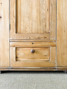 A Handsome English 19th Pine Cupboard with Dark Wooden Knobs