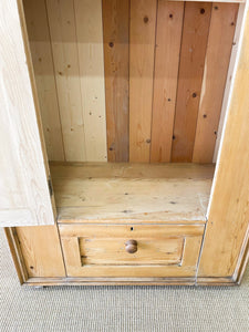 A Handsome English 19th Pine Cupboard with Dark Wooden Knobs