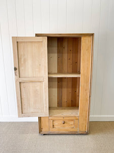 A Handsome English 19th Pine Cupboard with Dark Wooden Knobs