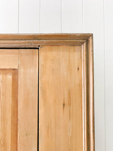 A Handsome English 19th Pine Cupboard with Dark Wooden Knobs