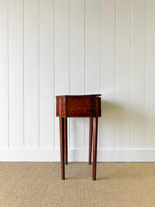 A Georgian Mahogany Sewing Table with Rising Lid