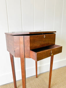 A Georgian Mahogany Sewing Table with Rising Lid