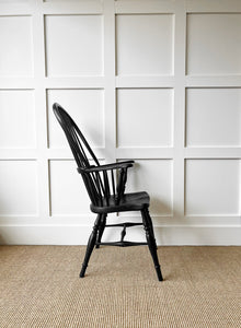 An Elm & Beech Windsor High Back Ebonized Armchair