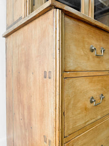 A 19th Century English Pine Bookcase with Arched Doors