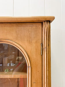 A 19th Century English Pine Bookcase with Arched Doors