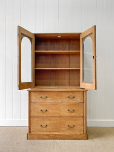 A 19th Century English Pine Bookcase with Arched Doors