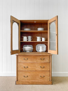 A 19th Century English Pine Bookcase with Arched Doors