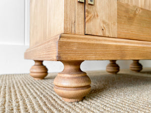 A Charming Pair of English Pine Nightstands with Bun Feet