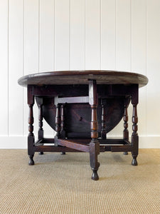 An Antique English Country Oak Drop Leaf Gate Leg Table