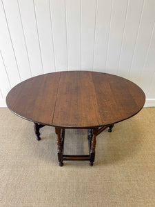 An Antique English Country Oak Drop Leaf Gate Leg Table