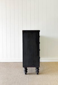 An Ebonized Antique English Chest of Drawers/Dresser