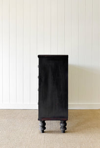 An Ebonized Antique English Chest of Drawers/Dresser